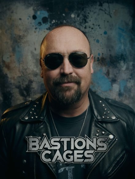 Bastion Cage – Christian Rutherford portrait with Bastions Cages logo overlay